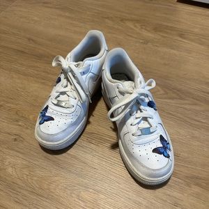 Customized white air force ones with blue butterfly’s. Size 8 women’s